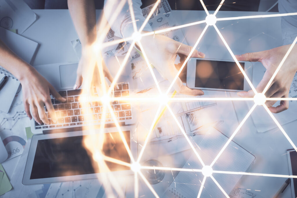 Double exposure of man and woman working together and social network theme hologram drawing. Computer background. connecting concept. Top View.